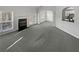 Open living area with a fireplace, neutral walls, and a view of the kitchen at 4540 Flat Willow Pl, Douglasville, GA 30135