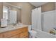 Bathroom featuring a single sink, vanity, mirror and standard toilet and tub-shower at 4668 Raiders Ridge Ct, Lithonia, GA 30038
