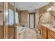 Bathroom featuring a soaking tub, a stand-up shower with a glass door, and double sinks at 4668 Raiders Ridge Ct, Lithonia, GA 30038