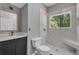 Modern bathroom featuring a tiled shower with a built-in bench at 4668 Raiders Ridge Ct, Lithonia, GA 30038