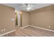 Spacious bedroom featuring wood-look flooring and a ceiling fan at 4668 Raiders Ridge Ct, Lithonia, GA 30038