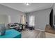 Bedroom featuring modern gray walls and hardwood floors at 4668 Raiders Ridge Ct, Lithonia, GA 30038