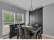 Dining room with a large window and views of the surrounding greenery at 4668 Raiders Ridge Ct, Lithonia, GA 30038