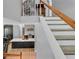 Foyer leading to a kitchen island with modern barstools at 4668 Raiders Ridge Ct, Lithonia, GA 30038