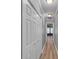Hallway with wood-look flooring and a bi-fold closet door at 4668 Raiders Ridge Ct, Lithonia, GA 30038
