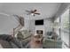 Bright living room with fireplace and large windows at 4668 Raiders Ridge Ct, Lithonia, GA 30038