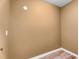 Neutral tan wall with white baseboards and a flush-mounted ceiling light at 4668 Raiders Ridge Ct, Lithonia, GA 30038