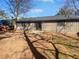 Spacious backyard featuring a patio and mature trees at 4673 Hairston Crossing Way, Stone Mountain, GA 30083