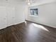 Large bedroom featuring wood flooring, a ceiling fan, and a window offering plenty of natural light at 4673 Hairston Crossing Way, Stone Mountain, GA 30083