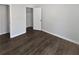Neutral bedroom featuring closet, wood-look flooring, and natural light at 4673 Hairston Crossing Way, Stone Mountain, GA 30083