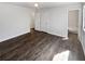 Spacious bedroom with hardwood floors, ample closet space, and an attached bathroom at 4673 Hairston Crossing Way, Stone Mountain, GA 30083