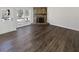 Charming living room featuring wood floors, a stone fireplace, and natural light at 4673 Hairston Crossing Way, Stone Mountain, GA 30083