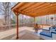 Spacious covered deck perfect for outdoor entertaining with string lights and comfortable seating at 1169 Harvest Brook Dr, Lawrenceville, GA 30043