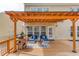 Covered back deck with comfortable seating, ideal for relaxing and entertaining guests at 1169 Harvest Brook Dr, Lawrenceville, GA 30043