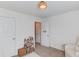 Cozy bedroom featuring chair, closet, and small storage unit at 1169 Harvest Brook Dr, Lawrenceville, GA 30043