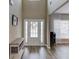 Charming entryway boasting wood flooring, a console table, and an abundance of natural light at 1169 Harvest Brook Dr, Lawrenceville, GA 30043