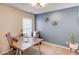 Bright office featuring a modern desk, comfortable chair, and stylish wall decor at 1169 Harvest Brook Dr, Lawrenceville, GA 30043