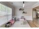 Bright playroom featuring neutral tones, a large window, and playful furniture at 1169 Harvest Brook Dr, Lawrenceville, GA 30043