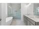 This bathroom offers a luxurious soaking tub, glass shower with marble surround and double sink vanity at 2140 Parkside Ln, Roswell, GA 30076