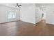 Spacious bedroom features hardwood floors, neutral walls, ceiling fan and bright, natural light at 2140 Parkside Ln, Roswell, GA 30076