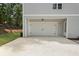 Attached two car garage with extended driveway and well maintained lawn at 2140 Parkside Ln, Roswell, GA 30076