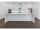 Stylish kitchen with white cabinets, stainless steel appliances, and a center island, perfect for modern living at 2140 Parkside Ln, Roswell, GA 30076