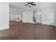 Open-concept living room with hardwood floors, leading to the kitchen and stairs, creating a seamless flow at 2140 Parkside Ln, Roswell, GA 30076