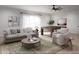 Cozy living room with comfortable sofa, pool table, stylish rug, and natural lighting at 2140 Parkside Ln, Roswell, GA 30076