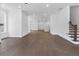 Open-concept living space with hardwood floors and modern finishes at 2140 Parkside Ln, Roswell, GA 30076