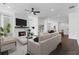 Spacious living room with fireplace, modern furnishings, and hardwood floors at 2140 Parkside Ln, Roswell, GA 30076