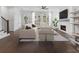 Bright living room with hardwood floors, fireplace, and large windows at 2140 Parkside Ln, Roswell, GA 30076
