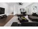 Modern living room featuring hardwood floors, contemporary furniture, and natural light at 2140 Parkside Ln, Roswell, GA 30076