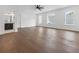 Large main bedroom with hardwood floors, ceiling fan, and windows for natural light at 2140 Parkside Ln, Roswell, GA 30076