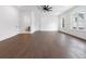 Spacious main bedroom with hardwood floors, a ceiling fan, and three doors at 2140 Parkside Ln, Roswell, GA 30076
