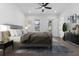 Comfortable bedroom with hardwood floors, ensuite bathroom, and a walk-in closet at 2140 Parkside Ln, Roswell, GA 30076