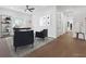 Bright office space with desk, decor, hardwood floors, and natural lighting at 2140 Parkside Ln, Roswell, GA 30076
