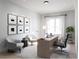 Bright office space with neutral walls, a desk, and seating area; natural light from large window at 2140 Parkside Ln, Roswell, GA 30076