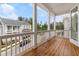 Enjoy the outdoors on this large porch with wood flooring and white railings at 2140 Parkside Ln, Roswell, GA 30076