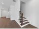 Modern staircase with wood treads and wrought iron railings at 2140 Parkside Ln, Roswell, GA 30076