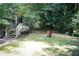 A backyard with a wooden deck, stairs, and a grassy yard at 3938 Landress Way, Lawrenceville, GA 30044