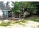 Cozy backyard featuring a deck, brick patio, and lush greenery, perfect for outdoor relaxation and entertaining at 3938 Landress Way, Lawrenceville, GA 30044