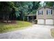 Charming two-story home with a well-manicured lawn and a two-car garage at 3938 Landress Way, Lawrenceville, GA 30044