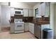 Functional kitchen with essential appliances and neutral finishes at 3938 Landress Way, Lawrenceville, GA 30044