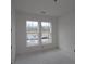 A bedroom with great light coming in from two windows. A blank canvas awaits your personal touch at 2040 Ripple Park Bnd, Canton, GA 30114