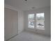 Bedroom with double closet and natural light pouring in, offering a peaceful retreat at 2040 Ripple Park Bnd, Canton, GA 30114