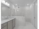 Modern bathroom with a double vanity, spacious glass shower, and elegant tile work at 2040 Ripple Park Bnd, Canton, GA 30114
