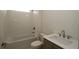 Clean bathroom with a shower-tub combo, neutral tile, and vanity at 2040 Ripple Park Bnd, Canton, GA 30114