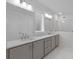 The luxurious bathroom boasts a double sink vanity and a glass-enclosed shower at 2040 Ripple Park Bnd, Canton, GA 30114