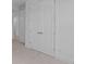 White bedroom with neutral carpet features double doors and simple design at 2040 Ripple Park Bnd, Canton, GA 30114