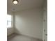 Comfortable bedroom with one window and a door, providing natural light and privacy at 2040 Ripple Park Bnd, Canton, GA 30114